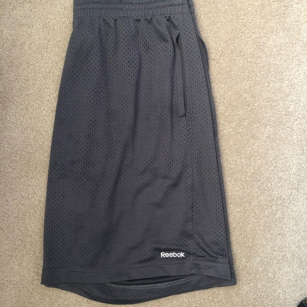 Grey Reebok athletic shorts.